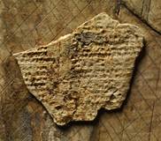 Detail of the wax layer of one ivory writing board from Nimrud, still preserving a part of the astronomical omen series Enuma Anu Enlil inscribed in the cuneiform script. Detail of the wax layer of one ivory writing board from Nimrud, still preserving a part of the astronomical omen series Enuma Anu Enlil inscribed in the cuneiform script.